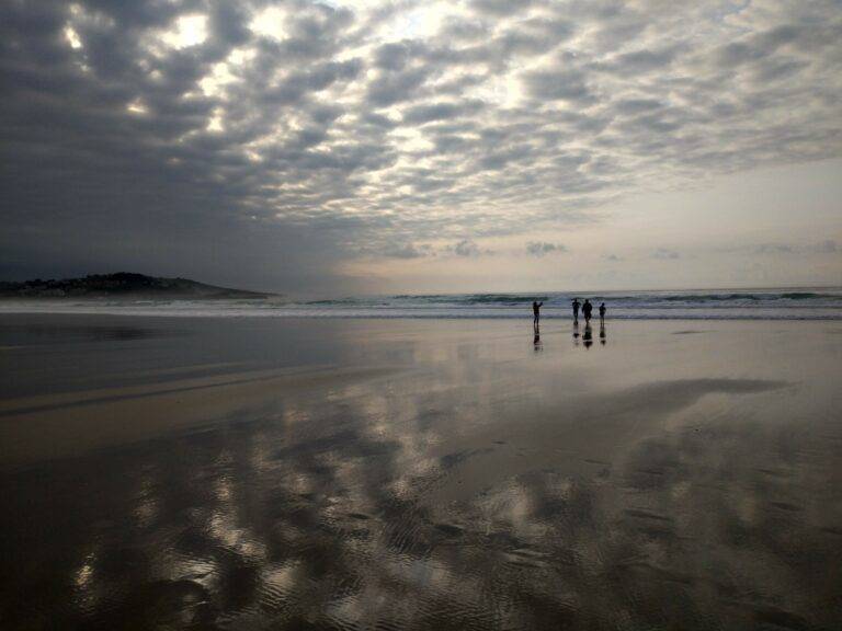 oyambre beach clouds reflecting in wet sand 2 dias en santander